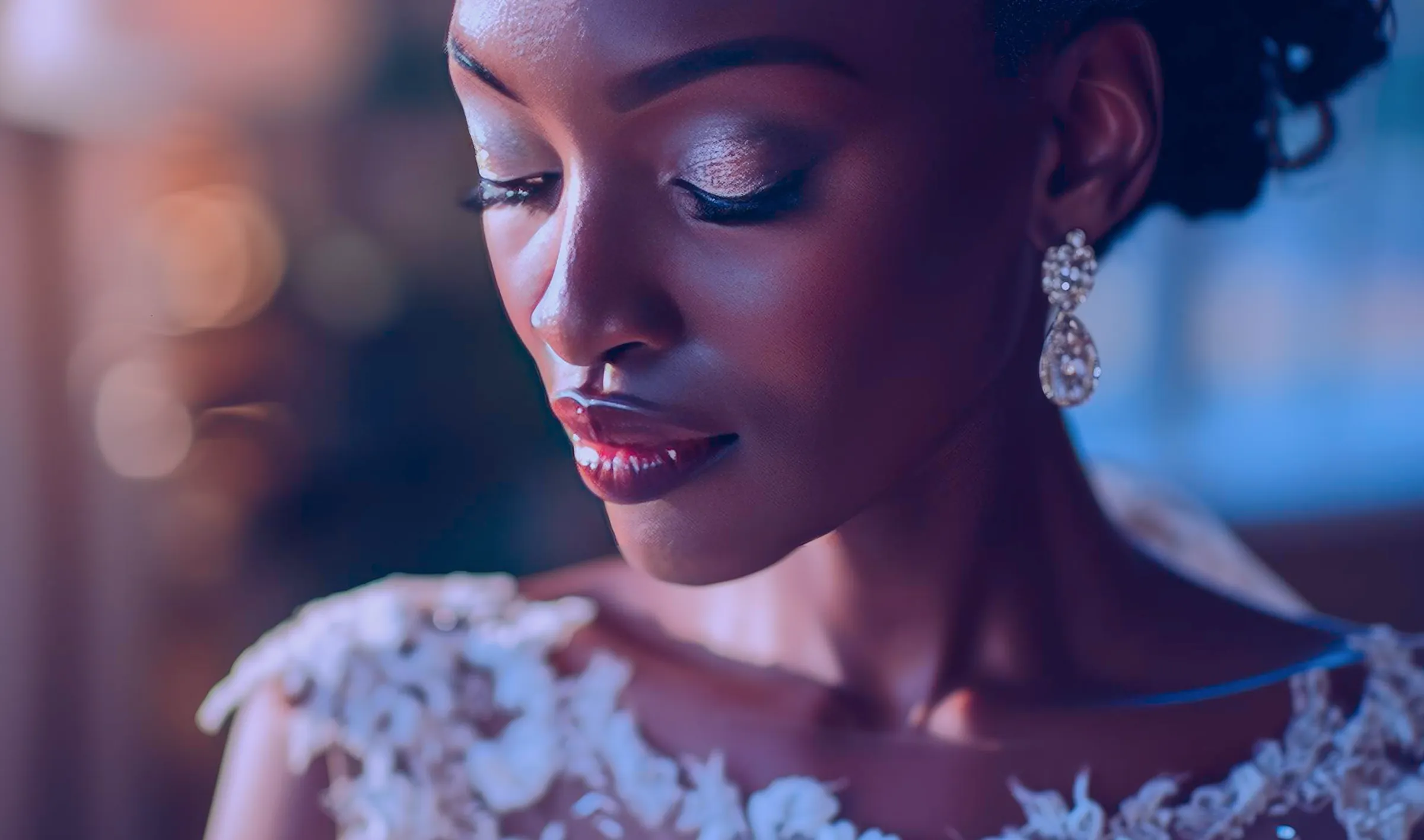 Woman with glowing makeup and crystal earrings